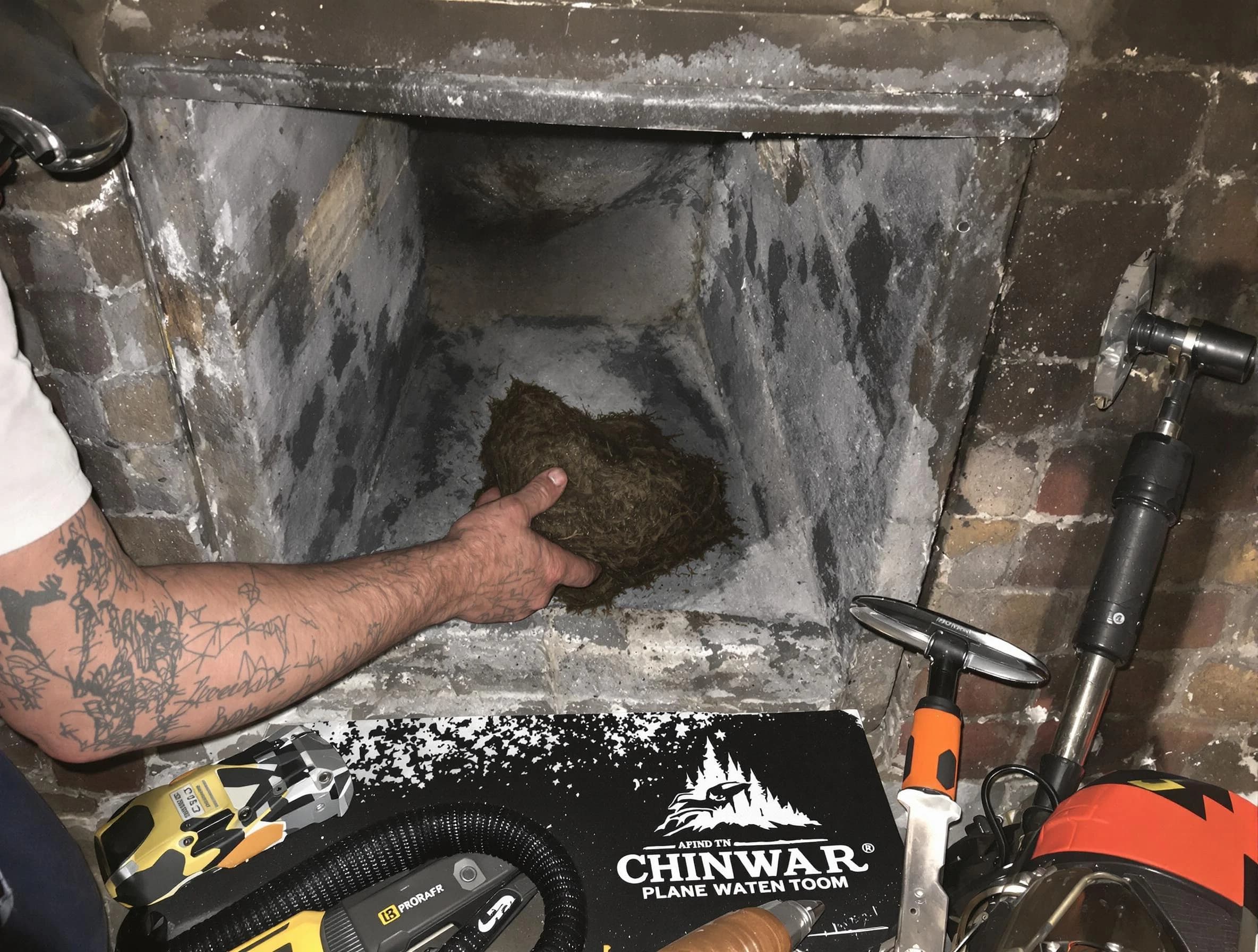 North Providence Chimney Sweep safely removing debris and screening chimney in North Providence, RI
